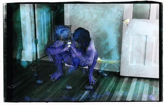 Sqatting Nude with Sack of Potatoes